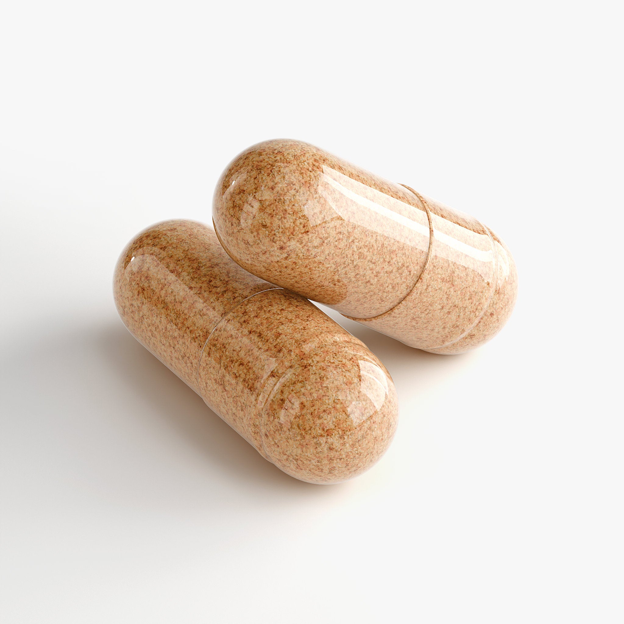 Two brown capsules on a white background
